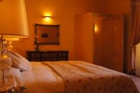 Łóżko lub łóżka w pokoju w obiekcie Petit Hotel Alaro