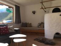 a living room with a couch and a fireplace at Apartment Hermine in Jochberg