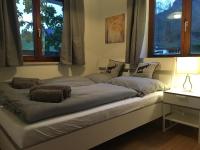 a bed with three pillows on it in a room at Apartment Hermine in Jochberg