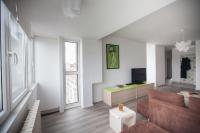 Televízia a/alebo spoločenská miestnosť v ubytovaní RiverView apartment