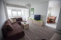 Televízia a/alebo spoločenská miestnosť v ubytovaní RiverView apartment