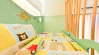 a childs bedroom with a bunk bed with a crib at Minsuku B&amp;B in Taitung City