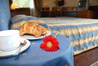 Łóżko lub łóżka w pokoju w obiekcie Hotel Luna