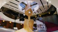 a spiral staircase in a building with a wooden structure at The Tree House in Kaohsiung