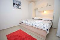 Posteľ alebo postele v izbe v ubytovaní APARTMANI IVONA & IVO