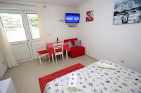 Posteľ alebo postele v izbe v ubytovaní APARTMANI IVONA & IVO