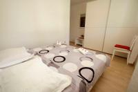 Posteľ alebo postele v izbe v ubytovaní APARTMANI IVONA & IVO