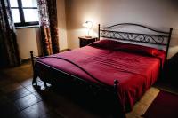 Łóżko lub łóżka w pokoju w obiekcie Sori San Giovanni