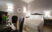 Łóżko lub łóżka w pokoju w obiekcie San Giuliano Inn