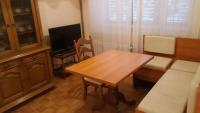 Televízia a/alebo spoločenská miestnosť v ubytovaní Family Apartments Marita