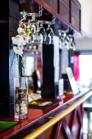 a vase filled with flowers sitting on a counter at Hotel Julie in Joensuu