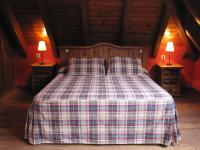 Postel nebo postele na pokoji v ubytování GRAN CHALET Hotel & Petit SPA