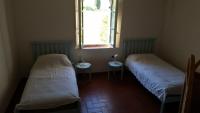 Posteľ alebo postele v izbe v ubytovaní villa montalcino palazzina castelverdelli