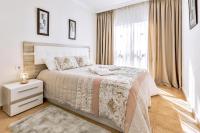 Łóżko lub łóżka w pokoju w obiekcie Ocean Pearl Apartment