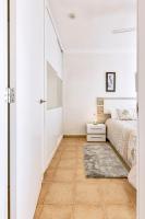 Łóżko lub łóżka w pokoju w obiekcie Ocean Pearl Apartment