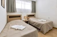 Łóżko lub łóżka w pokoju w obiekcie Ocean Pearl Apartment