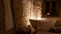 a bath tub in a bathroom with a window at Charme in Perillis in Popoli