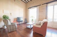 Televízia a/alebo spoločenská miestnosť v ubytovaní Apartamentos Deluxe Calle Corredera