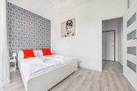 Łóżko lub łóżka w pokoju w obiekcie Apartamenty Sun & Snow Mila Baltica