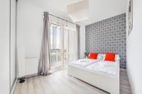 Łóżko lub łóżka w pokoju w obiekcie Apartamenty Sun & Snow Mila Baltica