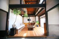 a living room with a couch and a table at the CUE in Tanabe