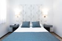 Postel nebo postele na pokoji v ubytování Hostal Oriente