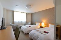 SUN PLAZA HOTEL 富士山中湖にあるベッド
