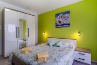 Posteľ alebo postele v izbe v ubytovaní Apartments Ani