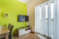 Televízia a/alebo spoločenská miestnosť v ubytovaní Apartments Ani