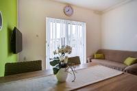 Televízia a/alebo spoločenská miestnosť v ubytovaní Apartments Ani