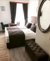 a bedroom with a bed and a large mirror at Pension Babenberger in Melk