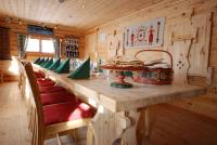 a long wooden table in a room with chairs at Hakkesetstølen Fjellstugu in Geilo