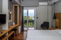 Posteľ alebo postele v izbe v ubytovaní Agamemnon Hotel