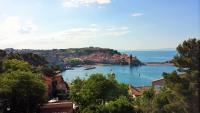 a view of a bay with boats in the water at 4SAP22 Appartement climatisé avec double terrasses in Collioure