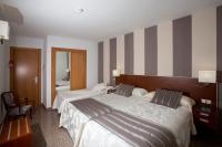 Postel nebo postele na pokoji v ubytování Hotel Marivella