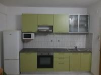 Kuchyň nebo kuchyňský kout v ubytování Apartmani PISAC