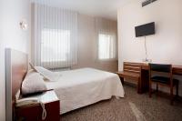Postel nebo postele na pokoji v ubytování Hotel Marivella