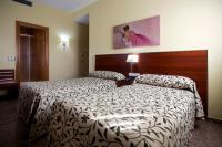 Postel nebo postele na pokoji v ubytování Hotel Marivella