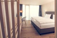 Postel nebo postele na pokoji v ubytování Klingenstein AKZENT Hotel Wirtshaus Brauerei