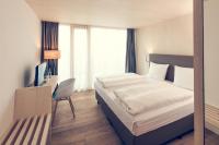 Postel nebo postele na pokoji v ubytování Klingenstein AKZENT Hotel Wirtshaus Brauerei