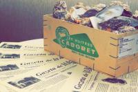 a box of pastries sitting on top of a table at Gostiny Dvor Hotel in Kharkiv