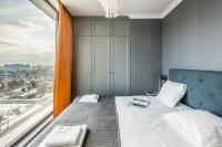 Posteľ alebo postele v izbe v ubytovaní Triton Park Apartments