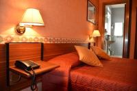 Ένα ή περισσότερα κρεβάτια σε δωμάτιο στο Hotel Milano