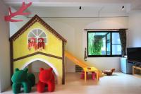 a room with a play house with dolls in it at Yudo B&amp;B Yilan in Dongshan