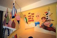 a childs room with a disney mural on the wall at Yudo B&amp;B Yilan in Dongshan
