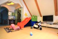 a childs room with a tv and toys in it at Yudo B&amp;B Yilan in Dongshan