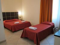 A bed or beds in a room at Hotel Della Volta