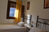 Cama o camas de una habitación en Apartamentos Vista Veleta