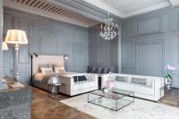 a bedroom with a bed and a couch and a table at Château de Pierreclos in Pierreclos