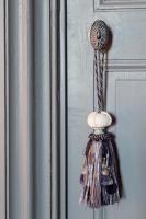 a bunch of tassels hanging on a wall at Château de Pierreclos in Pierreclos